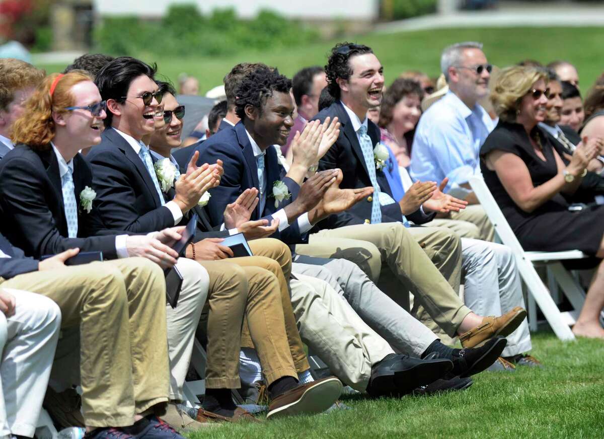 Graduates have a laugh during a light moment in the Canterbury School in New Milford's graduation ceremony Friday, May 25, 2018.