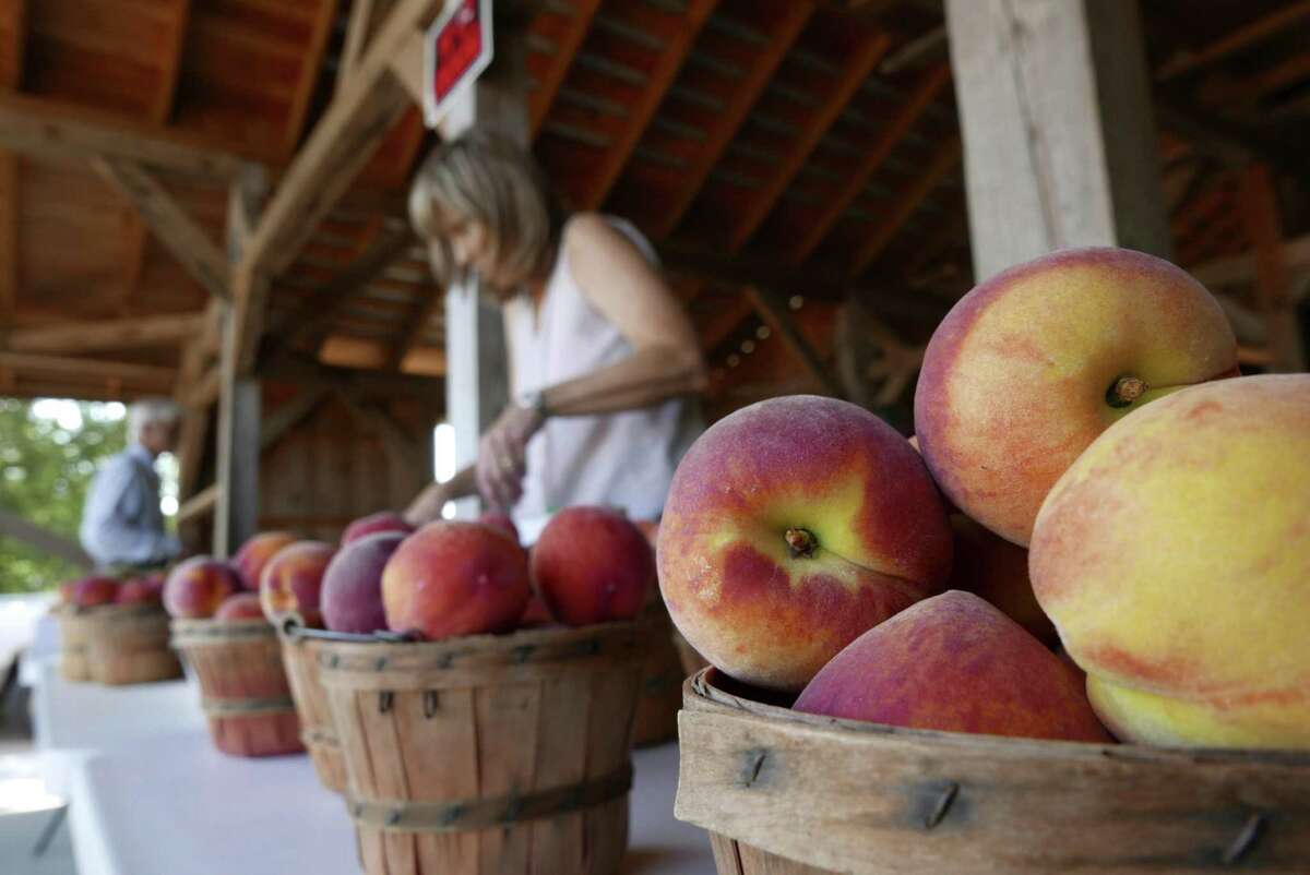 Baskets of fresh peaches are ready for buyers at a fruit stand run by Russ and Lori Studebaker near Fredericksburg on Friday, May 25, 2018. "We're really happy with the crop, it's really nice, really tasty," Russ Studebaker said.