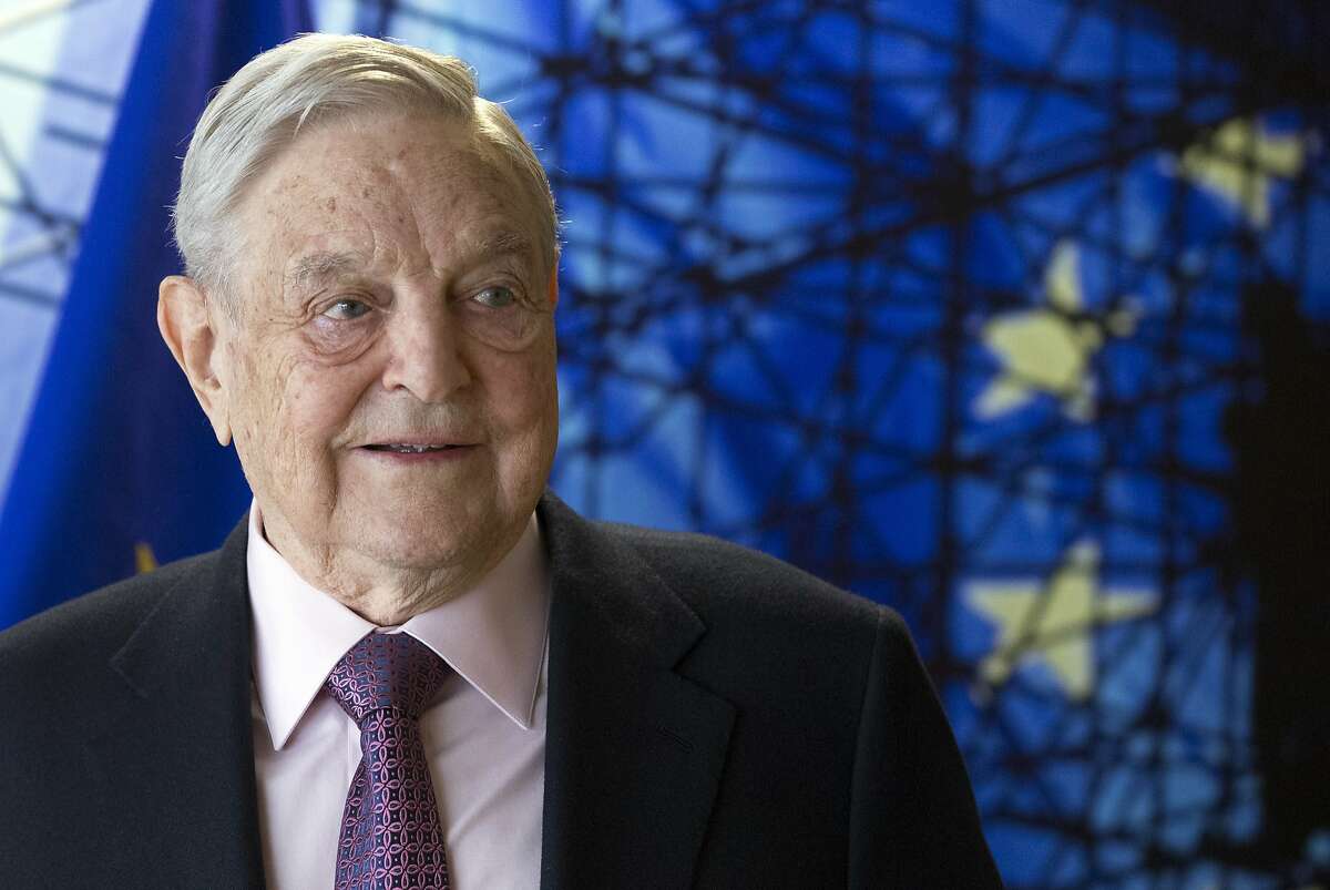FILE - This Thursday, April 27, 2017 file photo shows George Soros, Founder and Chairman of the Open Society Foundation, before the start of a meeting at EU headquarters in Brussels. Through the California Justice & Public Safety Political Action Committee, Soros' plunked $1.5 million into several California district attorney's campaigns including the races in Alameda, Contra Costa, Sacramento and San Diego counties. (Olivier Hoslet, EPA via AP, Pool,File)