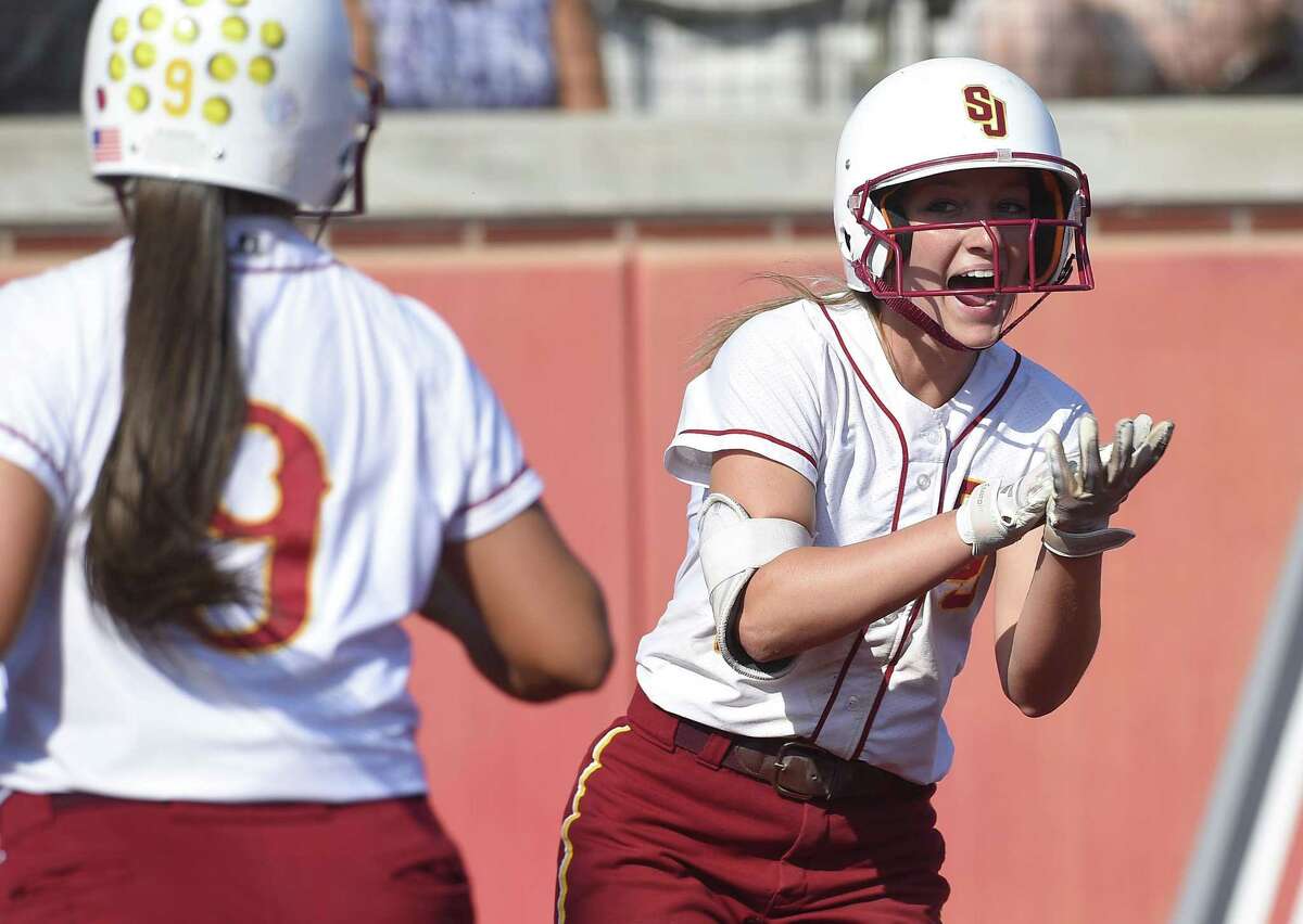 St. Joseph Hannah Hutchison (2) celebrates after scoring on a Madison Fitzgerald hit in the first inning against Trumbull in a FCIAC Softball Finals at Sacred Heart University on May 25, 2018 in Fairfield, Connecticut. St. Joseph defeated Trumbull 6-0.