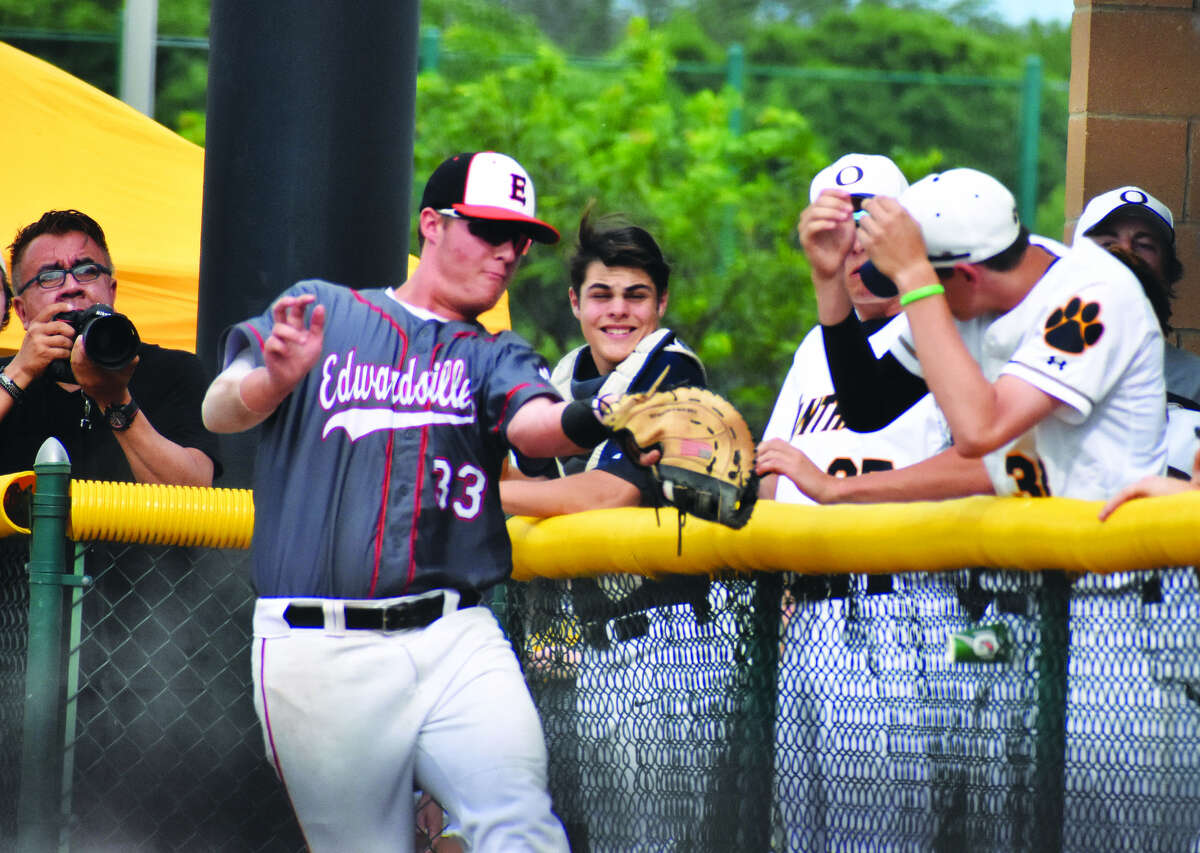Edwardsville first baseman Drake Westcott makes a catch near the O’Fallon dugout in the first inning of Friday’s Class 4A Edwardsville Regional championship game at Tom Pile Field.