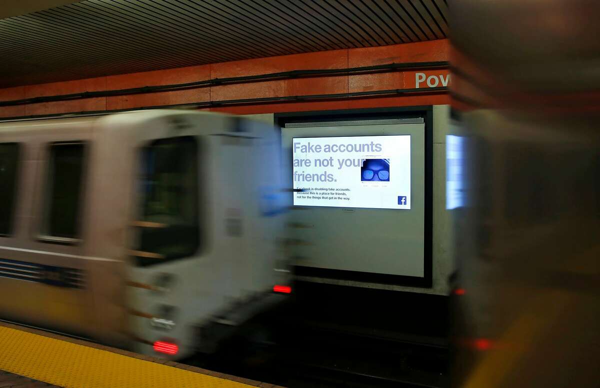 Facebook is running scrolling ads for their company on the train platform video screens at the Powell street BART station in San Francisco, Ca., as seen on Thurs. May 24, 2018.