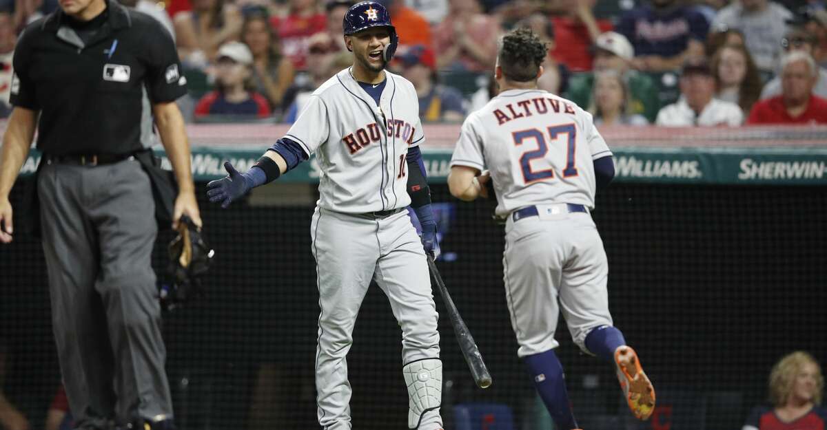 CLEVELAND, OH - MAY 25: Jose Altuve #27 of the Houston Astros celebrates with Yuli Gurriel #10 after scoring the go ahead run in the eighth inning against the Cleveland Indians at Progressive Field on May 25, 2018 in Cleveland, Ohio. (Photo by Joe Robbins/Getty Images)