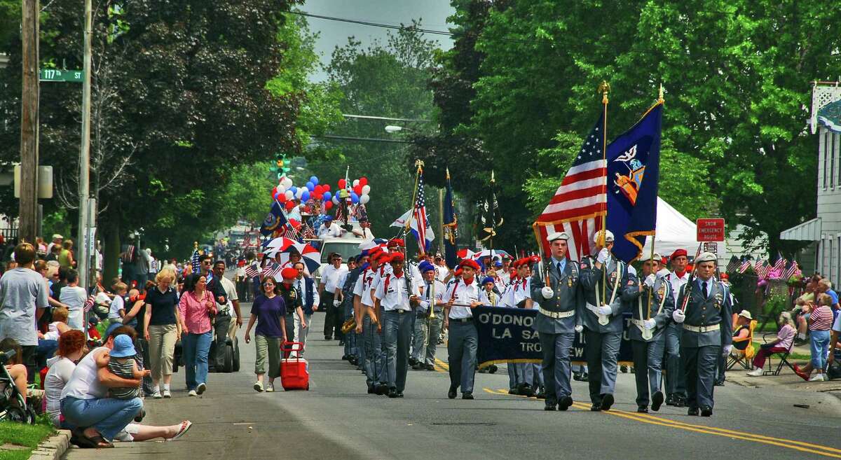 Times Union staff photo by John Carl D'Annibale The O'Donnovan Drill Team from LaSalle Institute in Troy, marches down a spectator-lined Fifth Ave., during the Lansingburgh Memorial Day Parade Monday May 29, 2006.