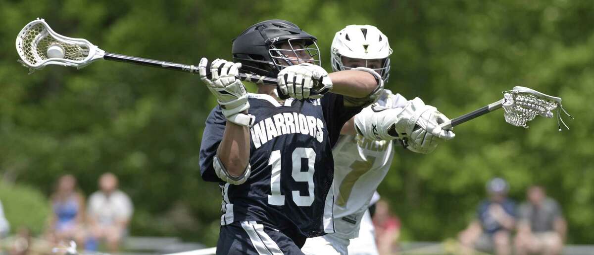 Norwich Tech's Jordan Switz (19) takes a shot on goal while being defended by Barlow's Alex Stillman (1) in the boys Connecticut Class M lacrosse game between Norwich Tech-Windham Tech and Joel Barlow high schools, Saturday afternoon, May 26, 2018, at Joel Barlow High School, Redding, Conn. Barlow defeated Tech 26-2.