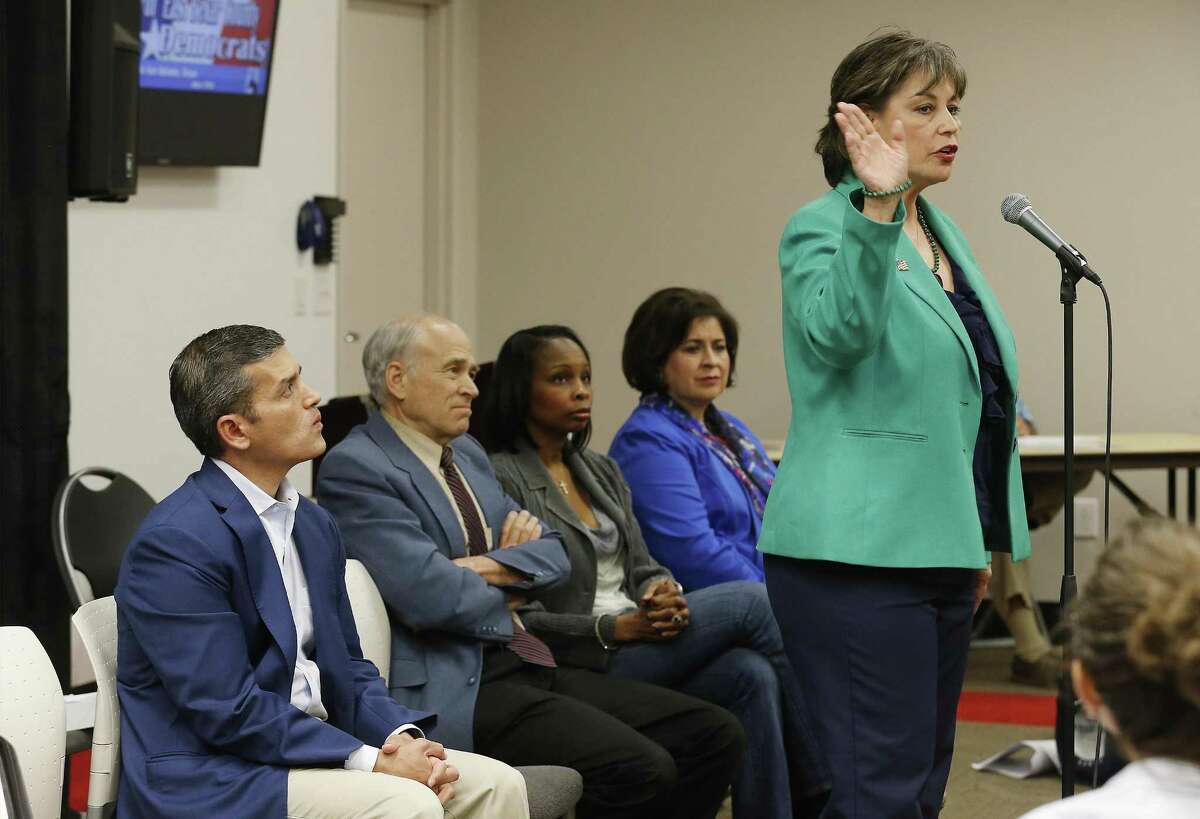 Mayoral candidate Cynthia Brehm (right) addresses an audience as other candidates Mike Villarreal (from left), Rhett Smith, then- mayor Ivy Taylor and Leticia Van de Putte join in a forum hosted by the North East Bexar County Democrats at Tri-Point on Saturday, Apr. 4, 2015.