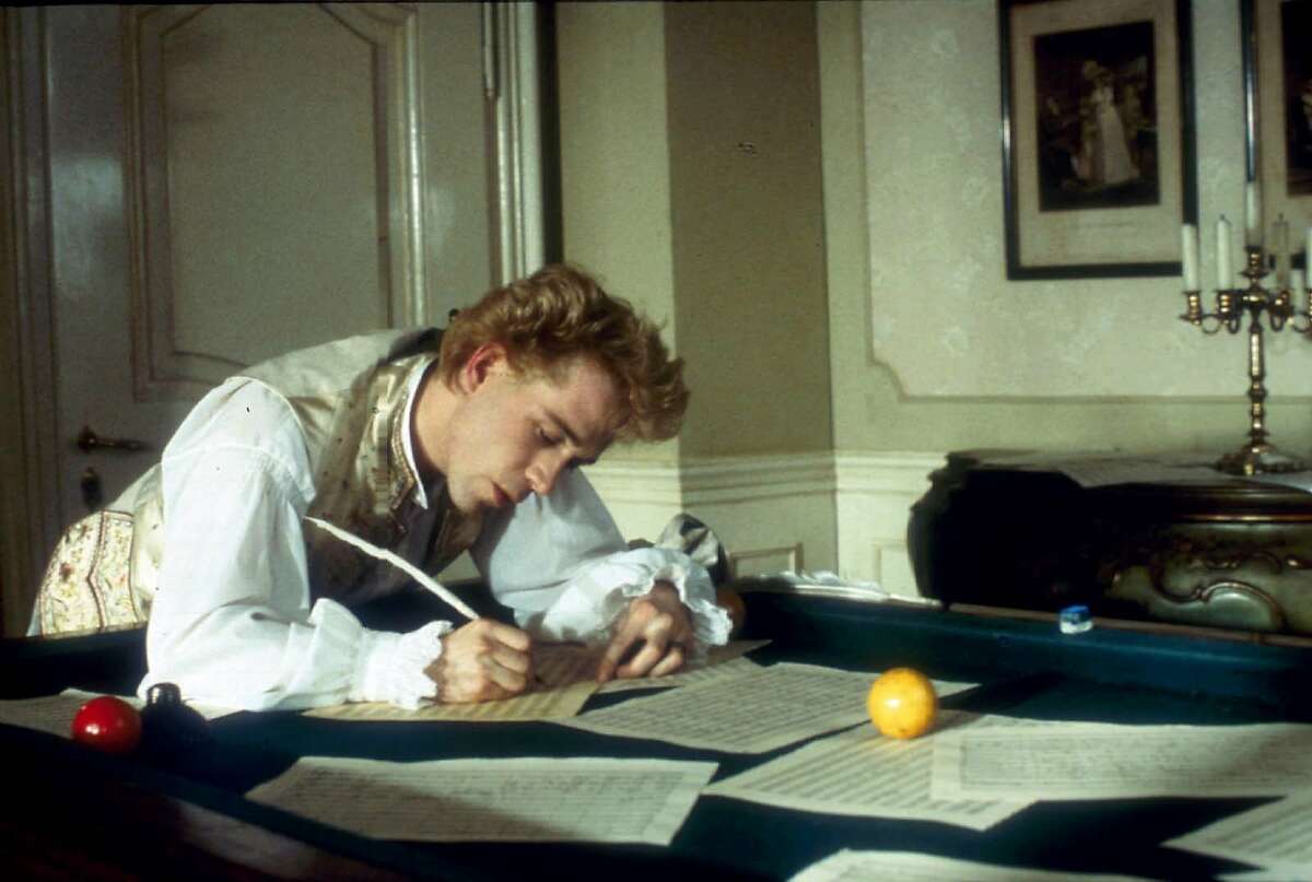 ADVANCE FOR WEEKEND EDITIONS APRIL 4-7 -- Mozart (Tom Hulce) composes music over a billiard table in the "Amadeus Director's Cut." (AP Photo/Saul Zaentz Company)