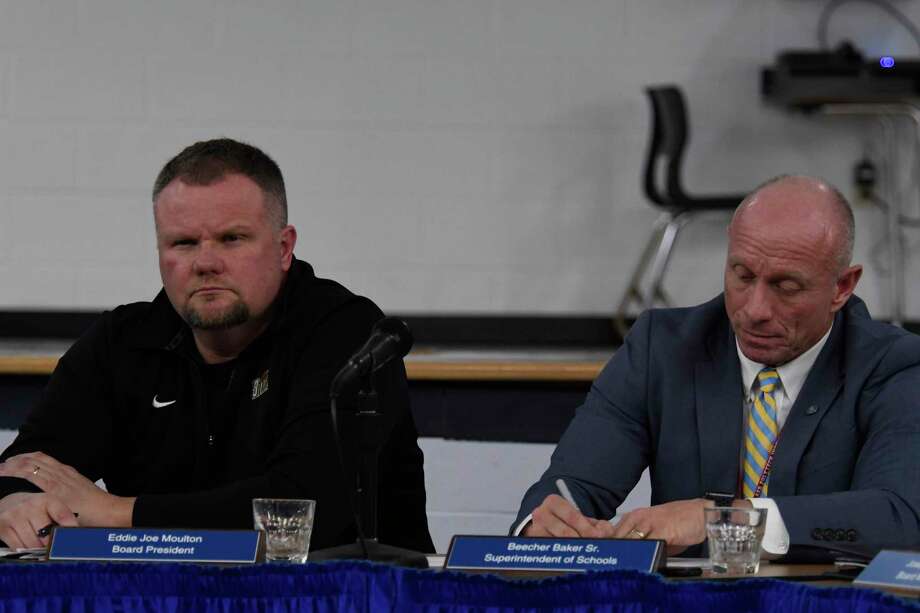 Hadley-Luzerne School Superintendent Beecher Baker, right, and School Board president Eddie Joe Moulton listen to another board member speak during a meeting on Monday, Mar. 5, 2018, at Hadley-Luzerne Elementary School in Lake Luzerne, N.Y. (Jenn March, Special to the Times Union) Photo: Jenn March / © Jenn March 2018 © Albany Times Union 2018