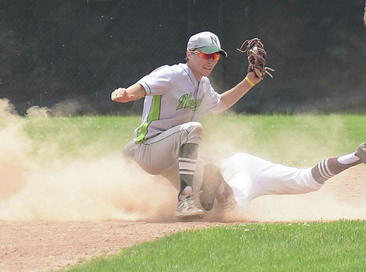 Norwalk's Jack Arnold tags out a Naugatuck runner at second base on a stolen base attempt during Saturday's Class LL state tournament preliminary game in Naugatuck. Norwalk won 9-3.