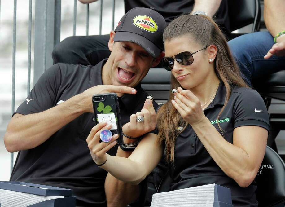 Tony Kanaan, of Brazil, and Danica Patrick take a selfie with their rings during the drivers meeting for the Indianapolis 500 auto race at Indianapolis Motor Speedway, in Indianapolis Saturday, May 26, 2018. (AP Photo/Darron Cummings) Photo: Darron Cummings / Copyright 2018 The Associated Press. All rights reserved.