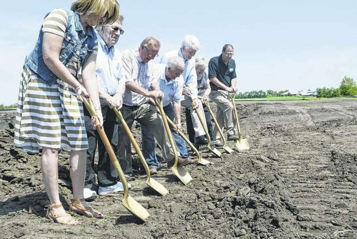 Several Virginia and Cass County officials and an aide to U.S. Rep. Darin LaHood attended a ground breaking Thursday for a new affordable housing project in Virginia. Using the ceremonial gold shovels are Cass County Clerk Shelly Wessel (from left) Cass County Board Chairman Dave Parish, Cass County Housing Authority Board Chairman Laymon Carter, Virginia Mayor Reg Brunk, Windsor Development Group President Mike Niehaus, Cass County Board member Joyce Brannan and Cass County Housing Authority Executive Director Steve Horton.
