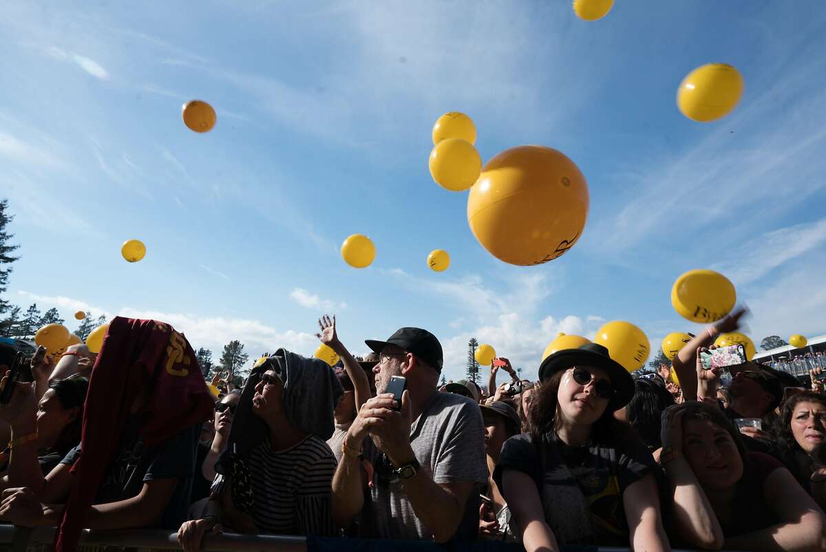 People shield themselves from the sun during a Billy Idol performance at the BottleRock Music Festival in Napa, Calif. on Saturday, May 26, 2018.