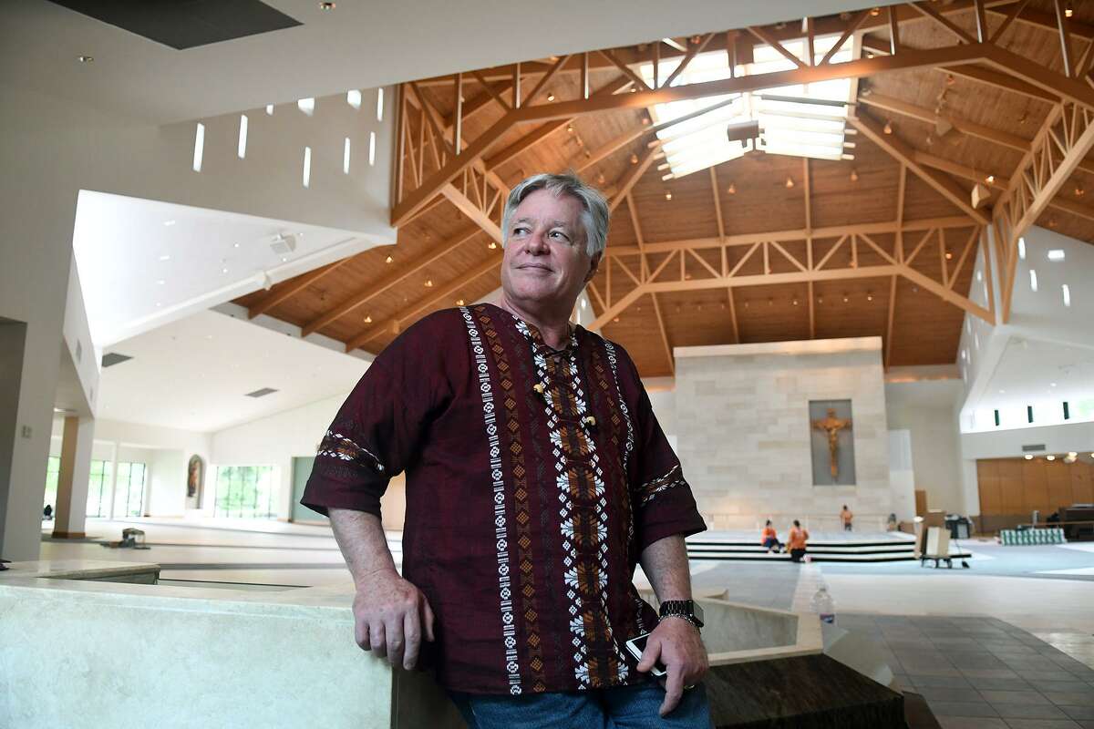 Father Norbert Maduzia stands in the nave of St. Ignatius of Loyola Catholic Church, which has been under construction for months due to major flood damage sustained during Hurricane Harvey last September. The congregation has been gathering for services in local school gyms and a tent in the church’s parking lot.