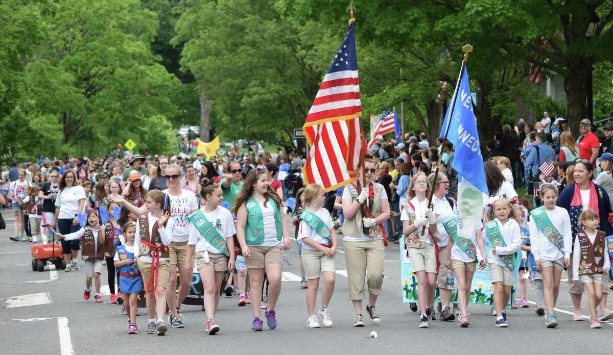 Spectrum/Numerous community organizations participated in the New Milford Memorial Day parade May 28, 2018. Above, Girl Scouts make their way along the east side of the Green at the start of the parade.