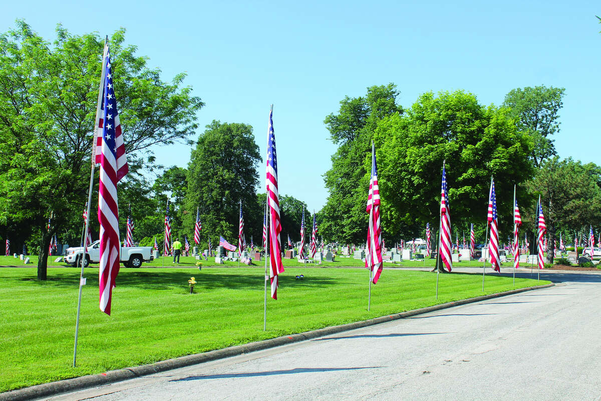 Sunset Hill Cemetery in Glen Carbon showed virtually no signs of being vandalized Monday as it was decorated for its annual Memorial Day service.