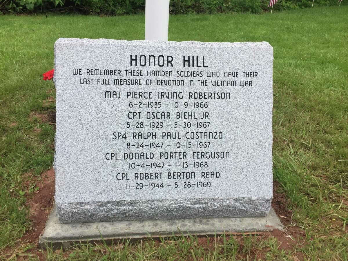 Residents of Hamden's Honor Hill neighborhood gathered Monday for the unveiling of a monument celebrating five men killed while serving in Vietnam.