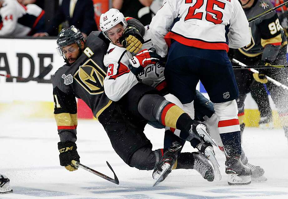 Vegas Golden Knights left wing Pierre-Edouard Bellemare, left, of France, takes Washington Capitals center Jay Beagle down during the second period in Game 1 of the NHL hockey Stanley Cup Finals, Monday, May 28, 2018, in Las Vegas. (AP Photo/John Locher) Photo: John Locher / Copyright 2018 The Associated Press. All rights reserved.