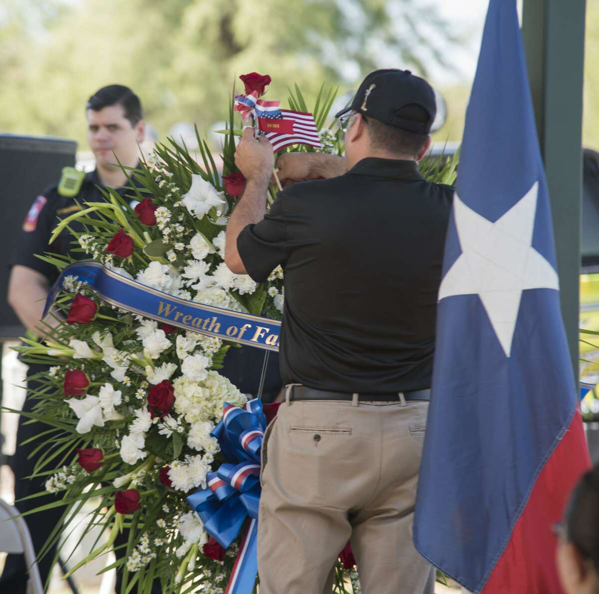 A wreath is placed to honor the fallen during a Memorial Day service at the Laredo City Cemetery on Monday. More than 200 names of local veterans were read.