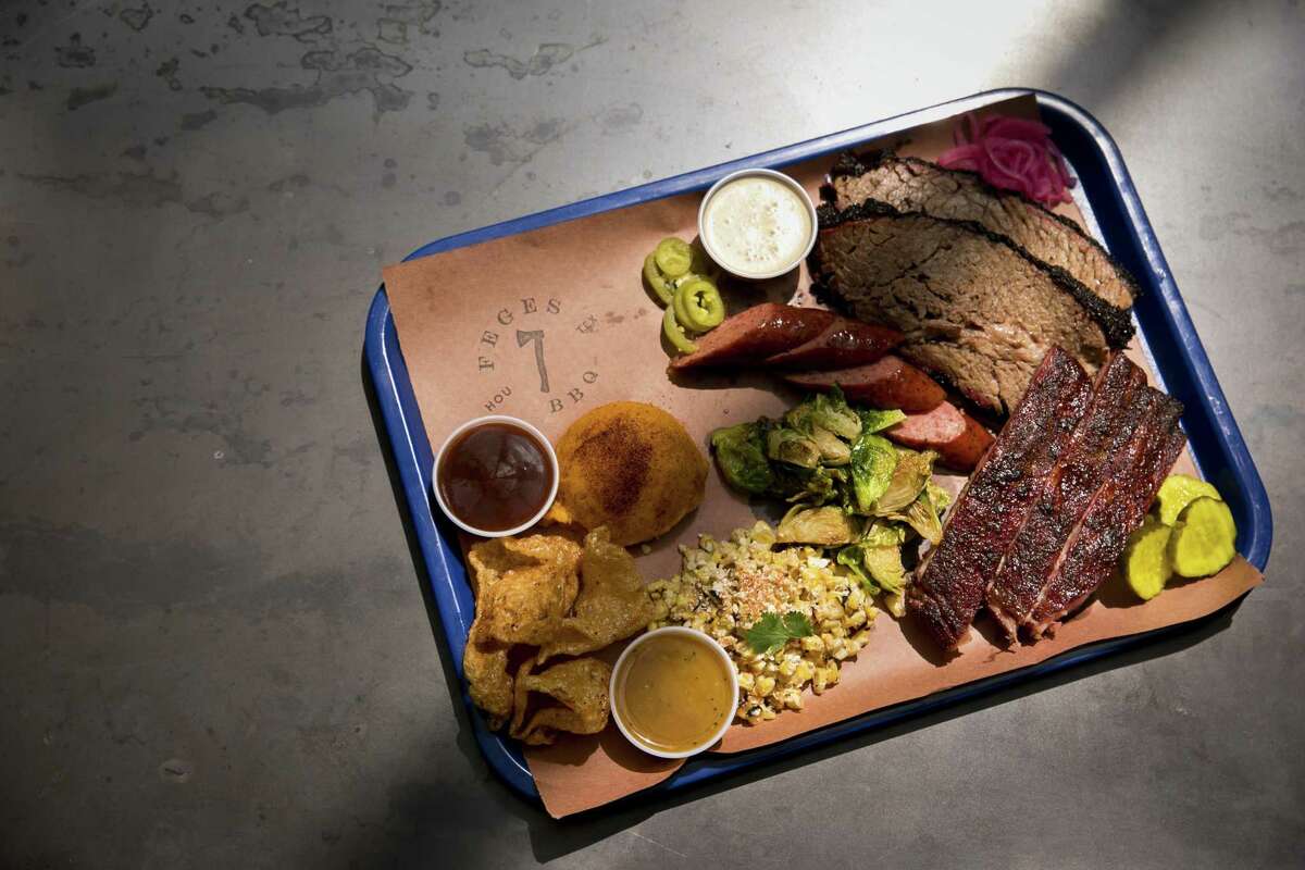 The Texas Trinity (brisket, pork ribs and sausage) with sides at Feges BBQ in Greenway Plaza