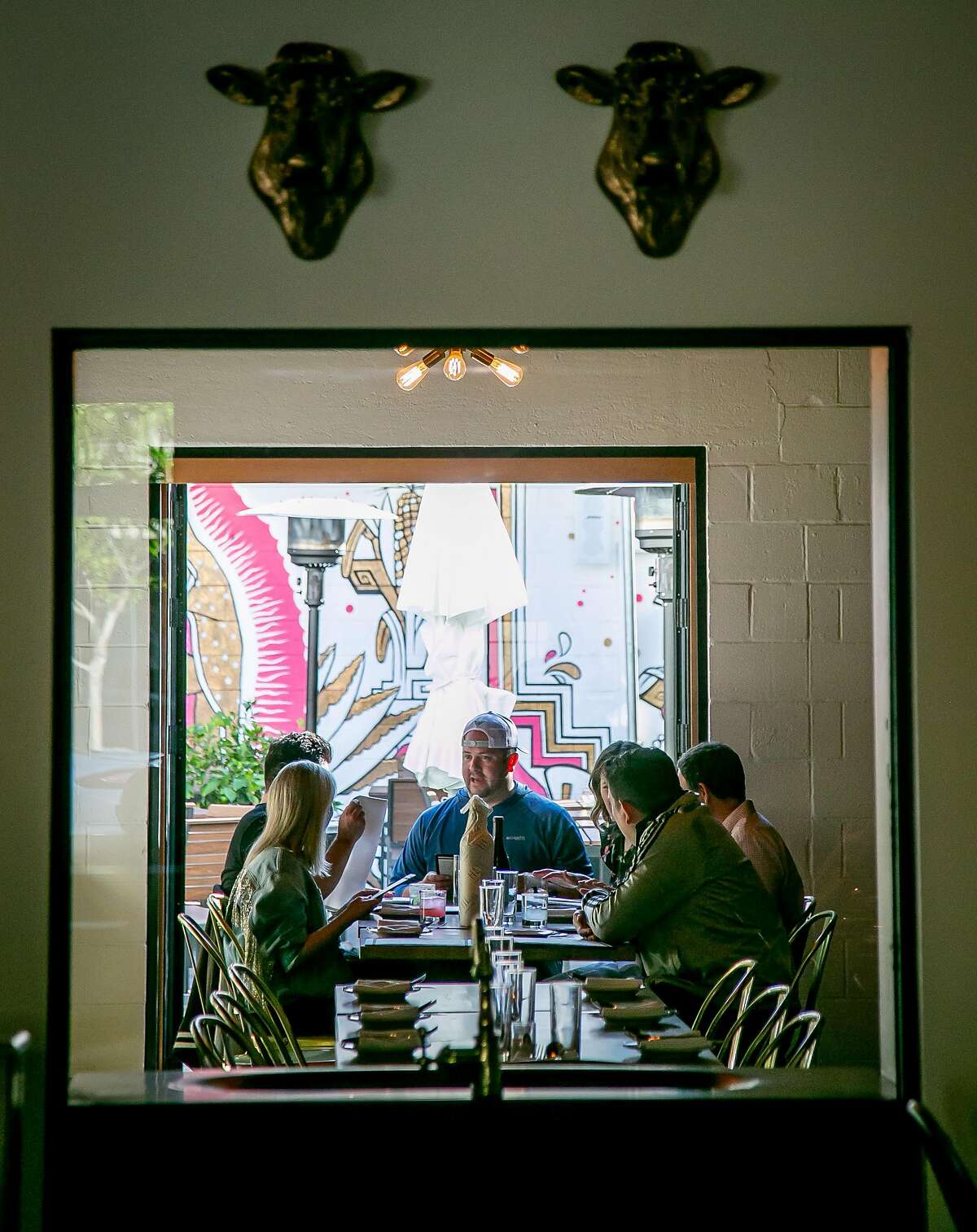 People have dinner at Gran Electrica in Napa, Calif., on May 26th, 2018.