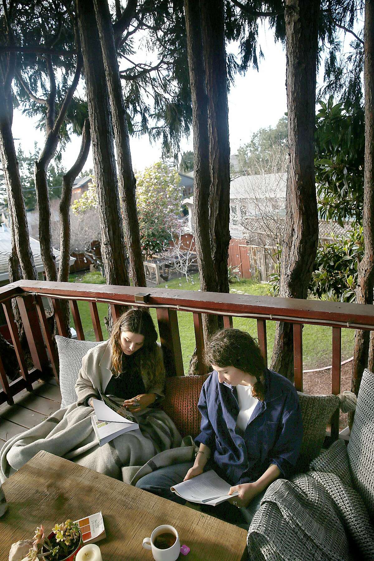 Lauren Tackberry and room mate Austin Sherman on the treehouse in the yard on Thursday, February 22, 2018, in Berkeley, Calif.