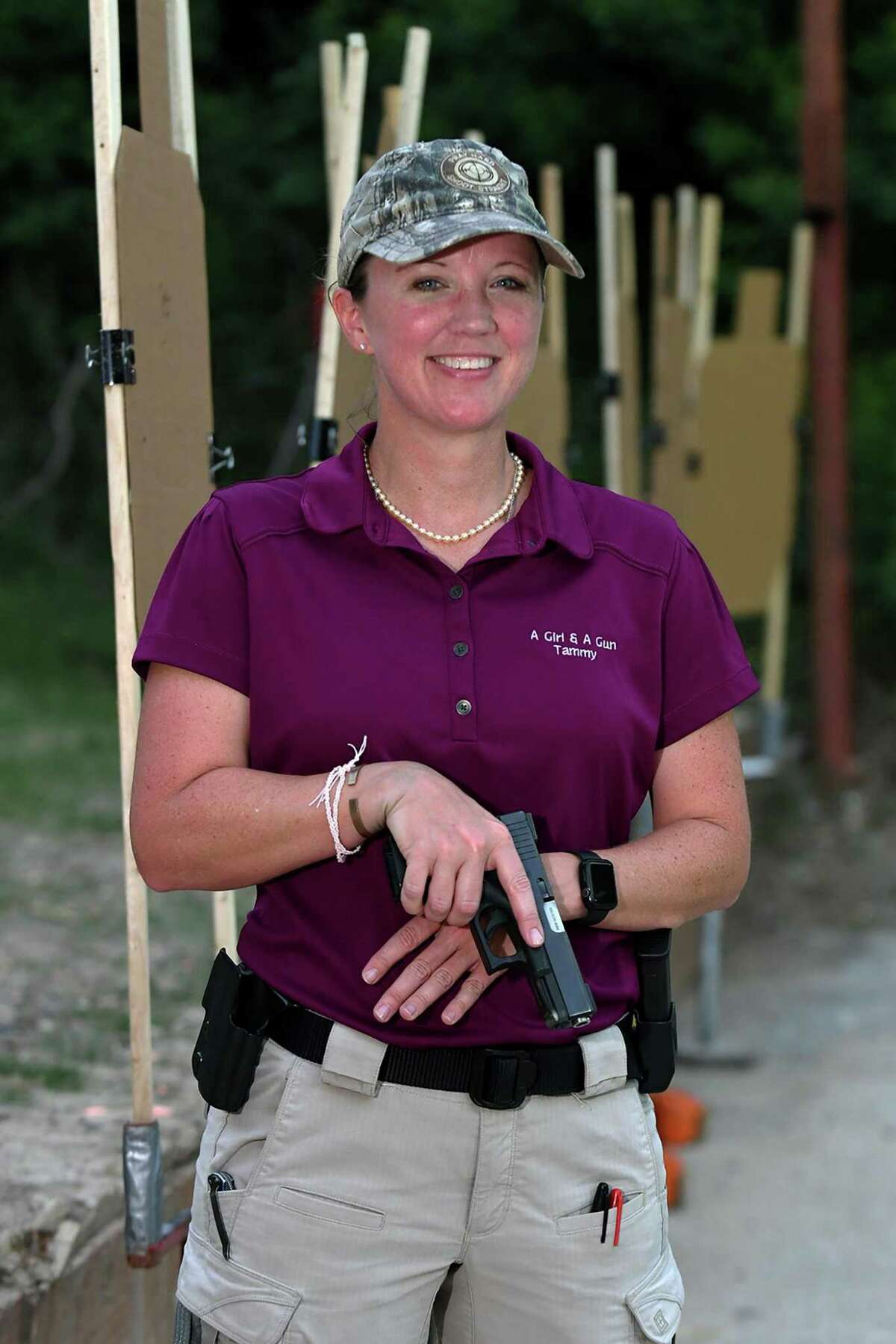 Tammy Hunter is the Cypress chapter leader for "A Girl and a Gun" women's shooting social group which practices at Hot Wells Shooting Range in Cypress. (Jerry Baker/For the Chronicle)