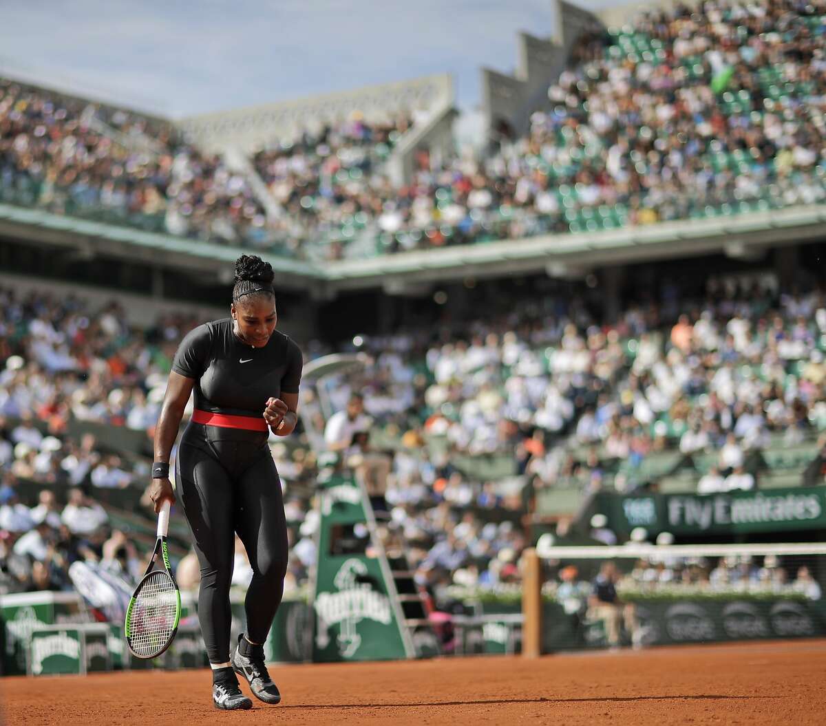 Serena Williams of the U.S. clenches her fist after scoring a point against Krystina Pliskova of the Czech Republic during their first round match of the French Open tennis tournament at the Roland Garros stadium in Paris, France, Tuesday, May 29, 2018. (AP Photo/Alessandra Tarantino)