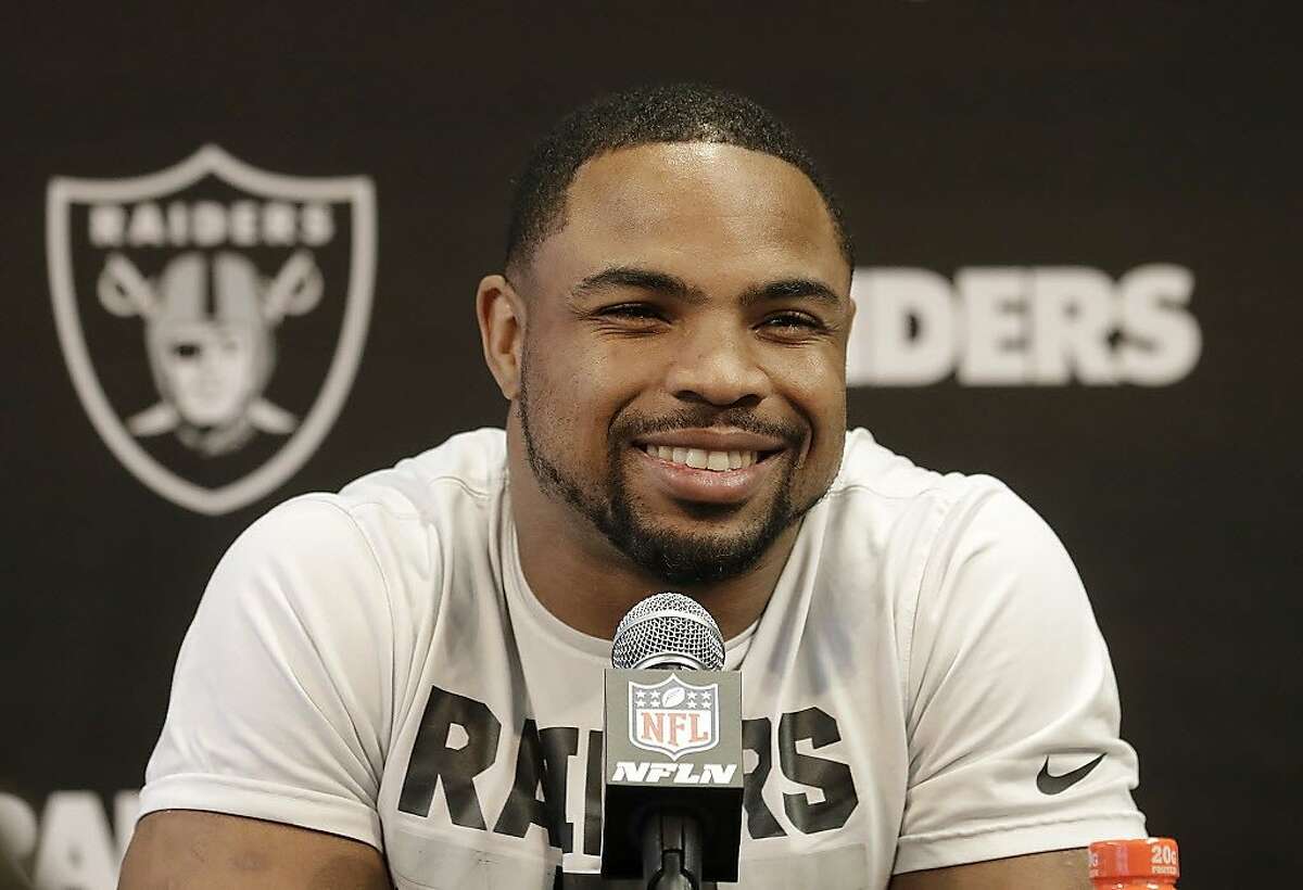 Oakland Raiders running back Doug Martin speaks to reporters at the team's NFL football training facility in Alameda, Calif., Tuesday, May 29, 2018. (AP Photo/Jeff Chiu)