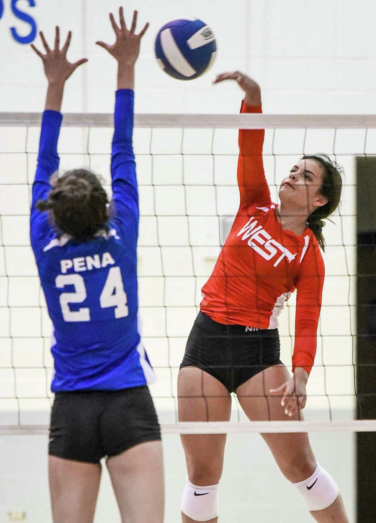Gabriela Canavati goes for a kill against Jennifer Pena during the Bosom Buddies All-Star game at St. Augustine.