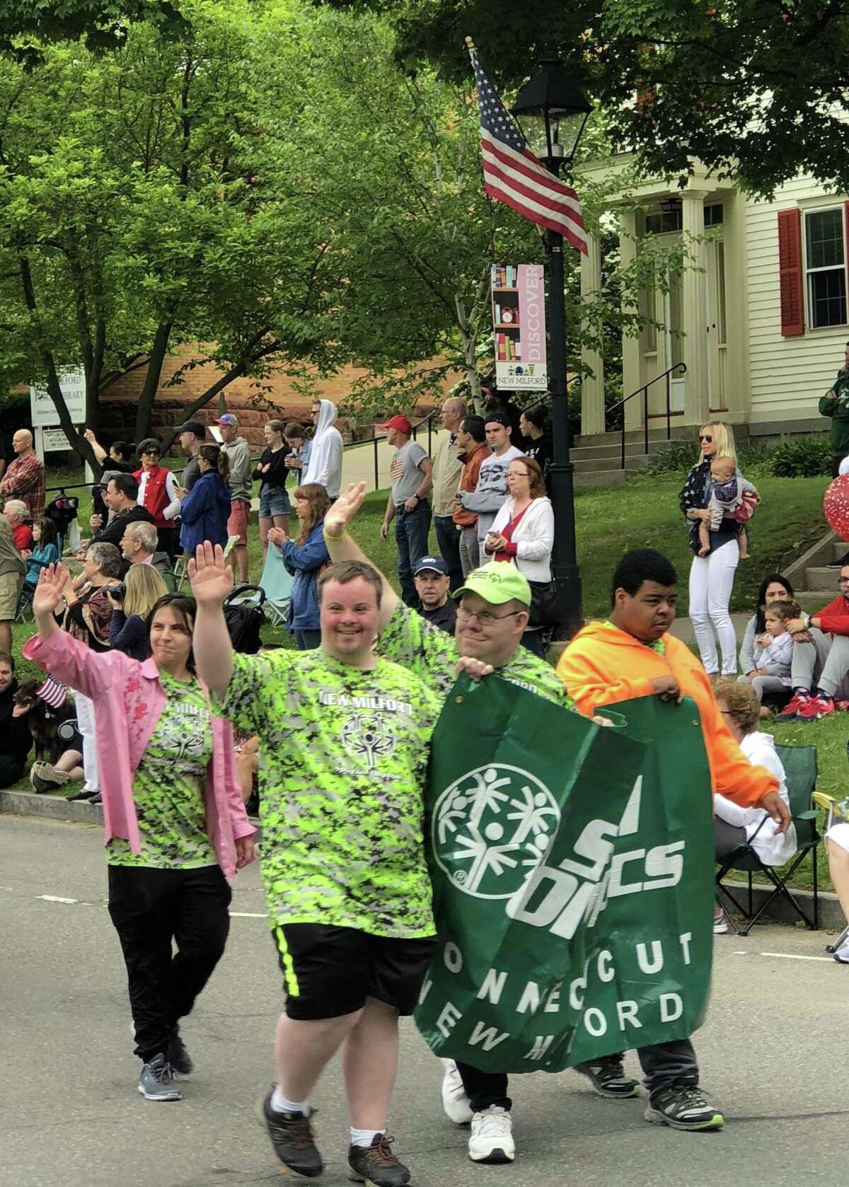 Individuals representing Special Olympics proudly wave to the crowds lining Main Street during New Milford's Memorial Day parade May 28, 2018.