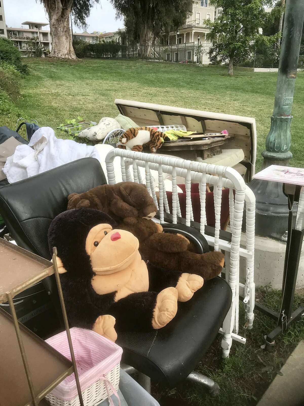 A stuff animal sits amid personal belongings left by homeless at Lake Merritt in Oakland. The city was clearing the park Wednesday ahead of Oakland hosting its fourth consecutive NBA championship.