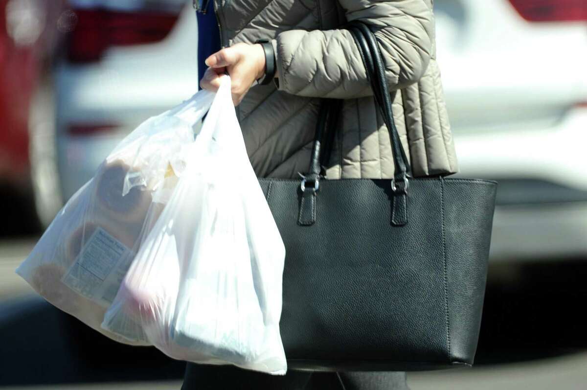 Customers exit Acme with plastic bags on High Ridge Road in this file photo. Stamford lawmakers are researching bans passed in other cities as they decide how to enact a plastic bag ban at all retail stores this fall.