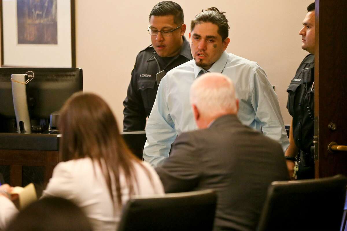 Daniel Lopez (top center) enters the court room during the third day of testimony in his retrial in the 379th state District Court at the Cadena-Reeves Justice Center on Wednesday, May 30, 2018. Lopez is accused with two others of beating, dismembering and burning body parts of his girlfriend's cousin, Jose Luis Menchaca, in retaliation over a stabbing in a drug deal gone bad. MARVIN PFEIFFER/mpfeiffer@express-news.net