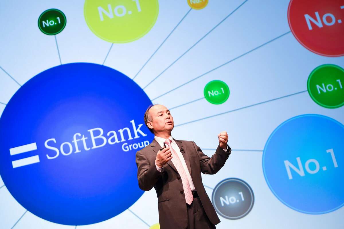 Masayoshi Son, chairman and chief executive officer of SoftBank Group Corp., gestures while speaking during a news conference in Tokyo, Japan, on Wednesday, May 9, 2018. SoftBank Group Corp.�s fourth-quarter profit topped analysts� projections, thanks to Sprint Corp.�s first annual net income in more than a decade. The U.S. wireless subsidiary is planning to merge with rival T-Mobile US Inc. Photographer: Noriko Hayashi/Bloomberg