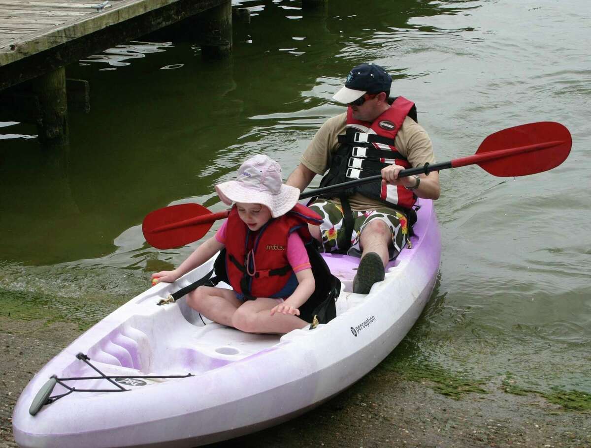 Daniel Renfrey and Zoe Renfrey return to the pier after spending a part of their afternoon paddling in Lake Livingston. Kayaking was one of many camping activities that Texas Outdoor Family participants learned and enjoyed on Saturday, April 2, and Sunday, April 3, at Lake Livingston State Park. Texas Outdoor Family is a program designed to teach families how to fish, kayak, cook out, set up a tent and base camp, and many other activities for $65 per family. The overnight Texas Parks and Wildlife Department program is conducted at numerous state parks.