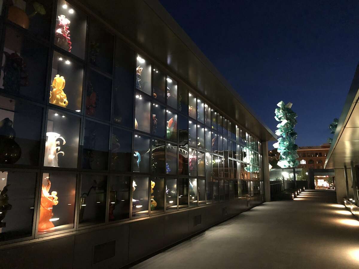Evening lights illuminate the Chihuly Bridge of Glass in Tacoma's Museum District.