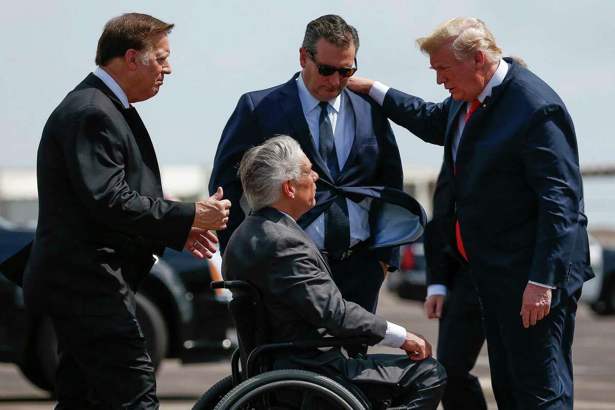 President Donald Trump meets with US Representative Randy Weber, left, Senator Ted Cruz, top center, and Governor Greg Abbott, bottom center, after landing at Ellington Field Joint Reserve Base Thursday, May 31, 2018 in Houston. Trump is scheduled to meet with those affected by the Santa Fe High School Shooting before attending a fundraiser.