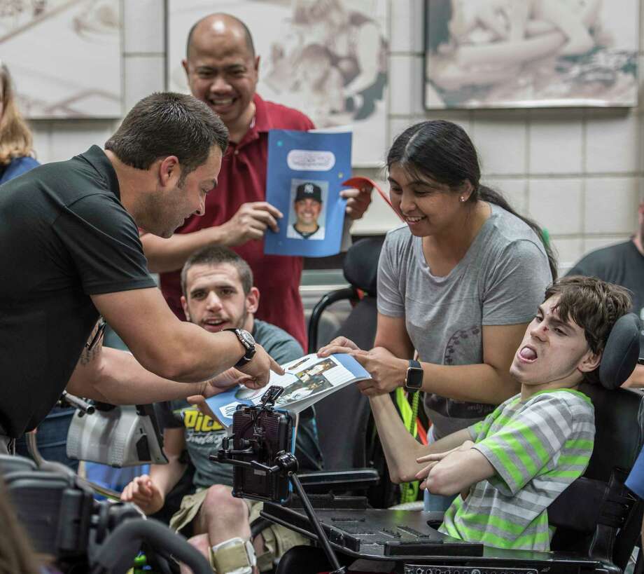 Former New York Yankee Nick Swisher greets students at the Langan School at the Center for Disability Services Thursday May 31, 2018 in Albany, N.Y.  (Skip Dickstein/Times Union) Photo: SKIP DICKSTEIN, Albany Times Union / 20043865A