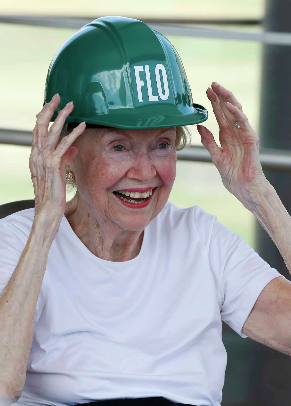 Flor Crichton puts on a hard hat as she is honored during a gathering of donors watching the moving of a 70-year-old live oak tree at Hemisfair Park, Thursday, May 31, 2018. Crichton funded the Juan O?•Gorman mural for the 1968 fair and also donated to save trees at the park for the development that is scheduled to open in 2021. For her philanthropic work in the 20th and 21st century, she will be honored with a grove of trees named, ?’The Flora Cameron Crichton Mural Grove,?“ providing the public a shaded view of the mural from civic park. Through donations totaling $550,000, 18 trees will be saved. In total, the park will have 246 shade-producing trees when it opens.