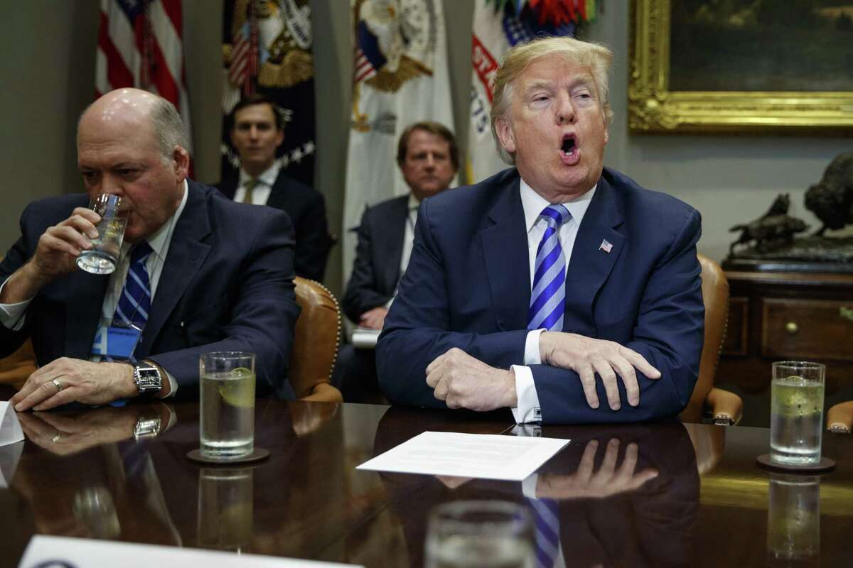 Ford CEO James Hackett listens as President Donald Trump speaks during a meeting with automotive executives in the Rosevelt Room of the White House, Friday, May 11, 2018, in Washington.