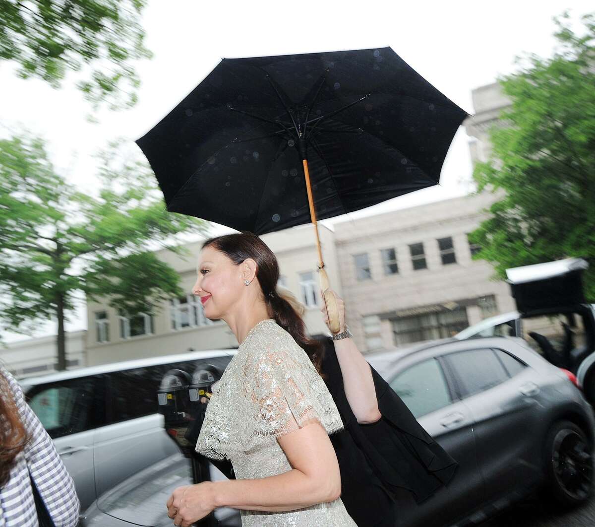 Ashley Judd arrives in the rain during the start of the Greenwich International Film Festival Changemaker Gala at Betteridge Jewelers in Greenwich, Conn., Thursday, May 31, 2018. The gala honored actress and activist Judd.