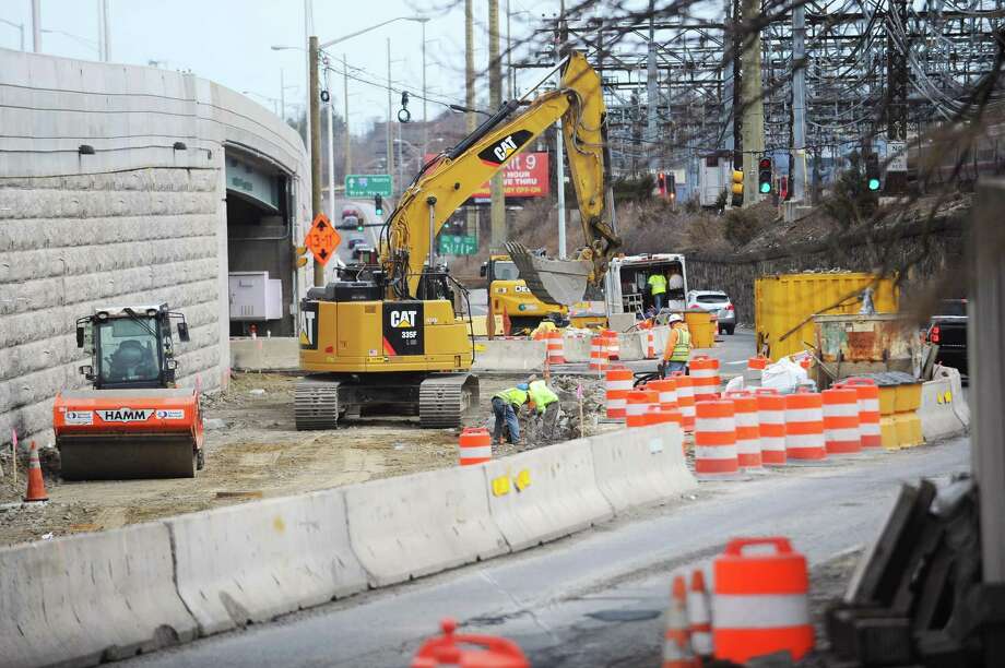 Construction workers continue the first phase of the Atlantic Street Bridge Project on South State St. in downtown Stamford, Conn. on Tuesday, March 27, 2018. The work, happening near I-95 Exit 8, is the first phase of a larger project to rebuild the railroad bridge that crosses over Atlantic Street. Photo: Michael Cummo / Hearst Connecticut Media / Stamford Advocate