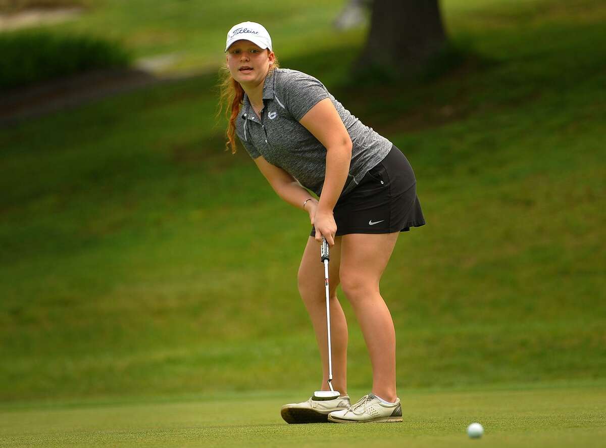 New Canaan’s Meghan Mitchell putts on the 2nd hole of the FCIAC Golf Championships at Fairchild Wheeler Golf Course in Fairfield on Thursday.