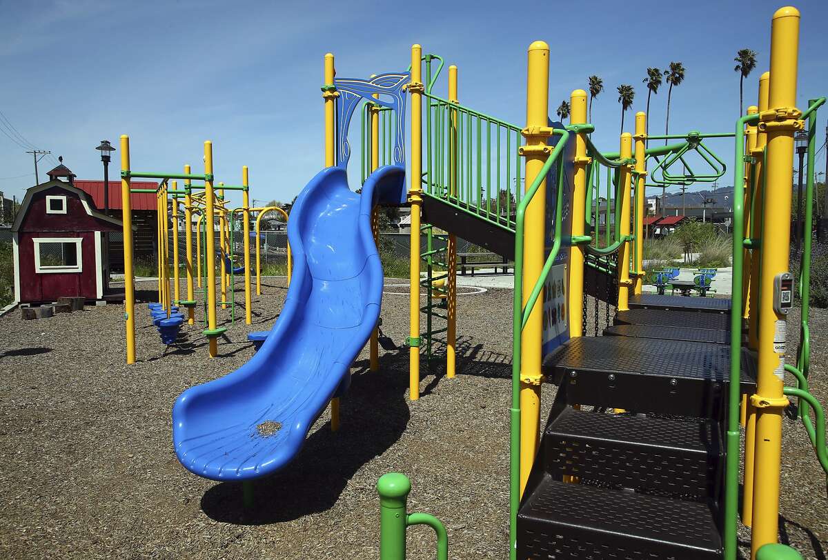 ADVANCE FOR USE SATURDAY, MAY 4, 2018 AND THEREAFTER-This Friday, April 13, 2018 photo shows a children's play area at the West Oakland Park and Urban Farm in Oakland, Calif. Proposition 68 would authorize $4 billion in bond funding for parks and water infrastructure, including $725 million to build parks in underserved neighborhoods. (AP Photo/Ben Margot, File)