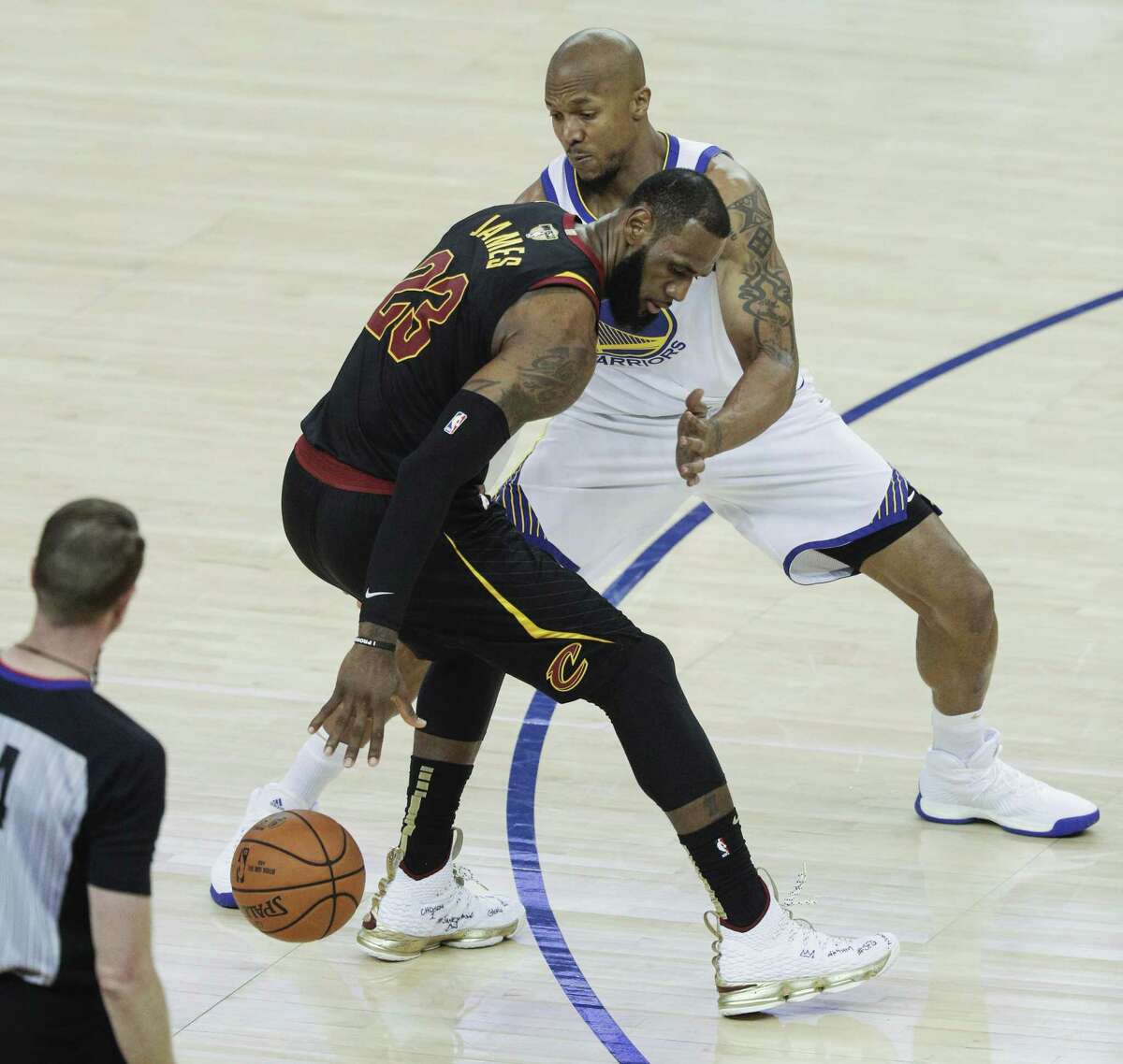 Golden State Warriors' David West defends against Cleveland Cavaliers' LeBron James in the second quarter during game 1 of The NBA Finals between the Golden State Warriors and the Cleveland Cavaliers at Oracle Arena on Thursday, May 31, 2018 in Oakland, Calif.