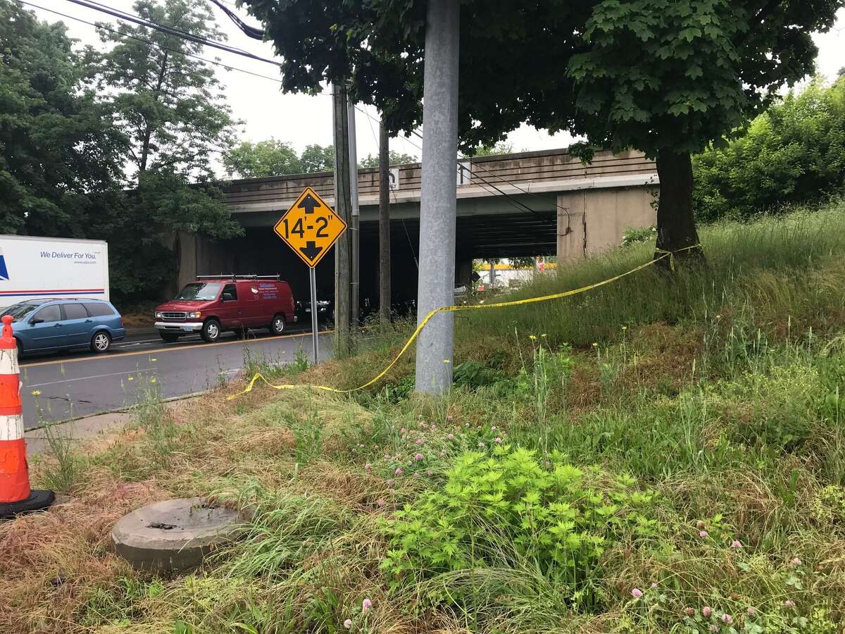Police tape is show on Friday near the I-95 overpass at West Avenue in Stamford, Conn., where police say a man was shot to death on Thursday night.