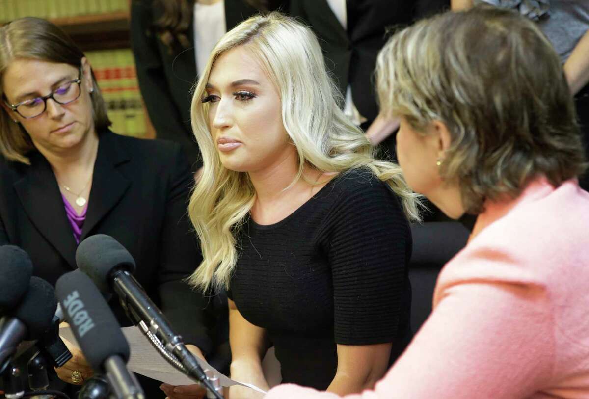 Former Houston Texans cheerleader Hannah Turnbow, center, speaks sitting between attorneys Kimberley Spurlock, left, and Gloria Allred, right, during a press conference announcing a lawsuit on behalf of five former Houston Texan NFL cheerleaders shown at the law offices of Kimberley Spurlock, 17280 West Lake Houston Parkway, in Humble, Friday, June 1, 2018.