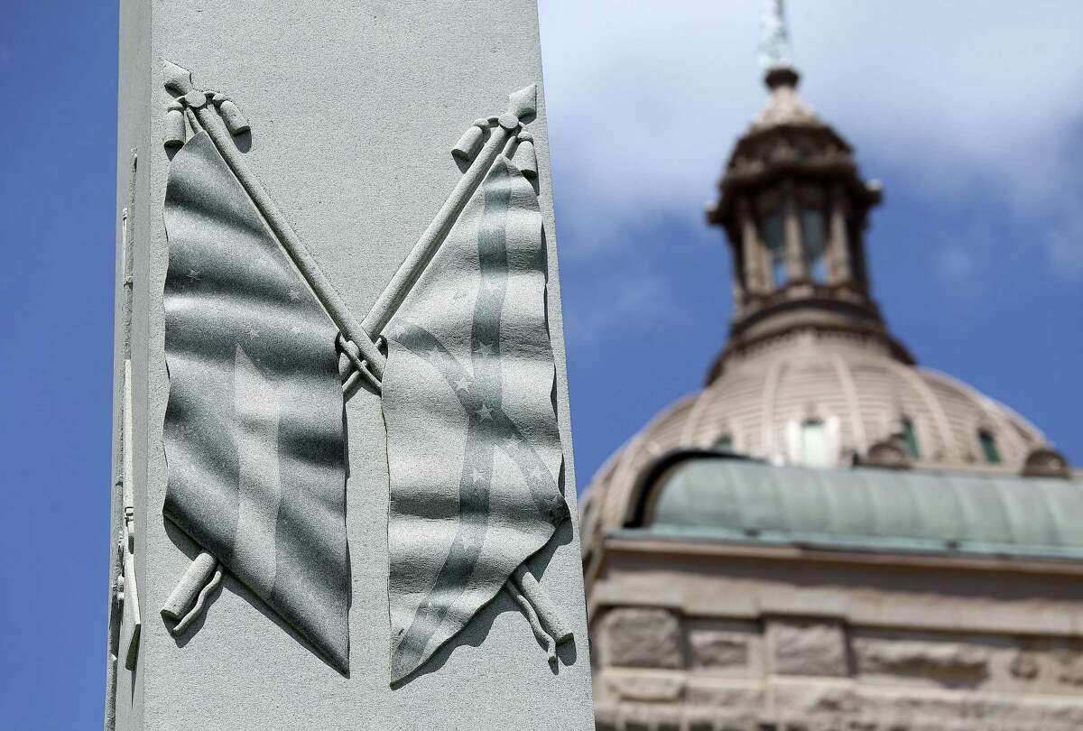 A depiction of Civil War flags adorns the side of the Texas Brigade monument on the east side of the State Capitol building in Austin.