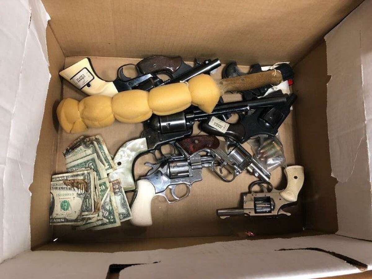 A box of guns, a steak knife and bloody money was found in the Harris County criminal courthouse in May 2018. It's not clear how they got there.