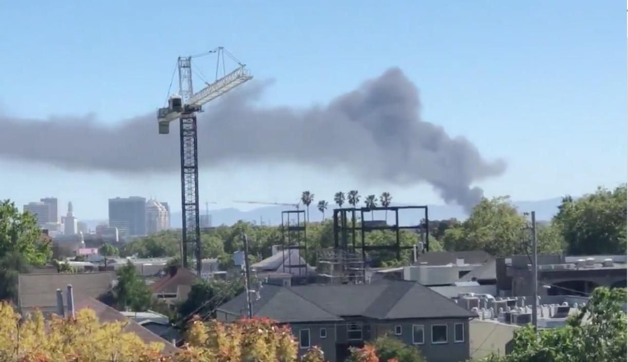 Fire at Oakland recycling plant sends black plume into sky